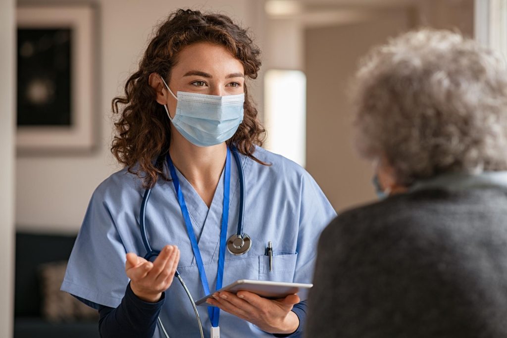 Nurse with elderly patient